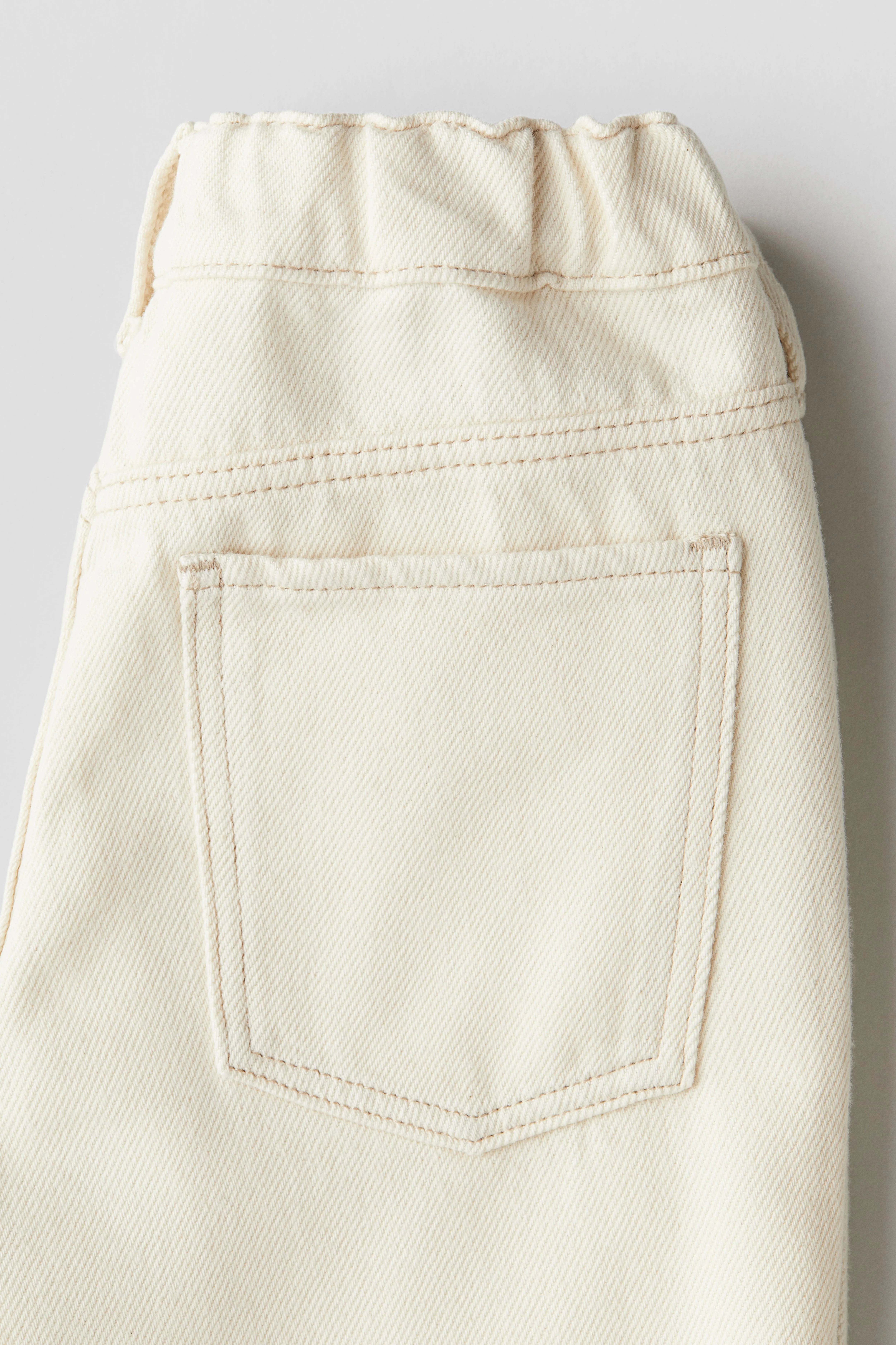 Tapered cotton-blend jeans - Regular waist - Long - Cream - Kids | H&M GB